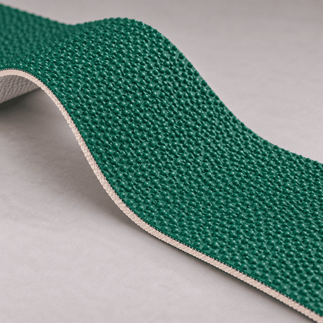 Generated illustration of green PVC rough top conveyor belt for inclined conveying